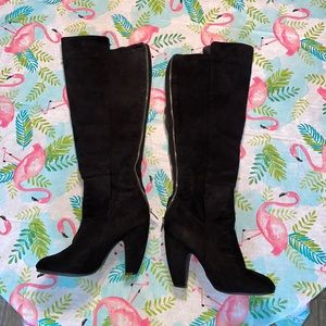 Black thigh high heeled boots